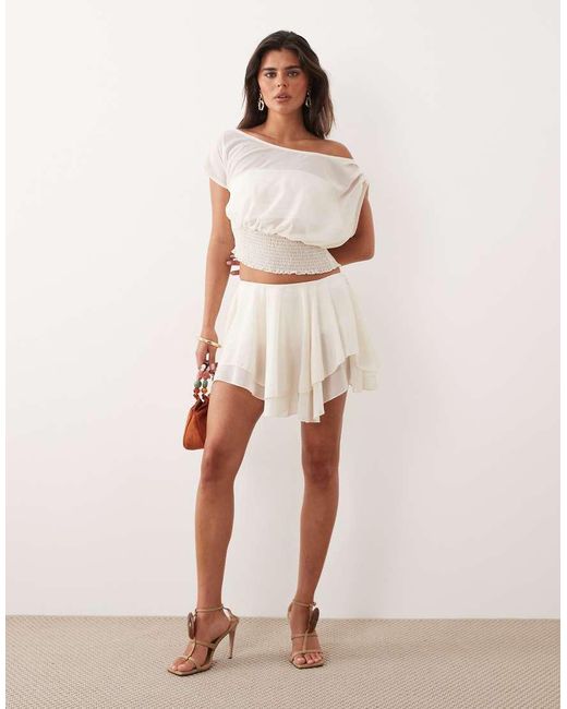 The Frolic Natural Exclusive Chiffon Drape Off Shoulder Shirred Waist Top