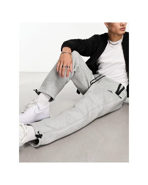 Nike Tech Fleece Loose Fit joggers With toggle in Grey for Men