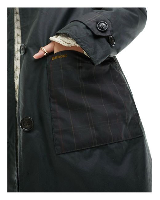 Newholm - manteau ajusté en tissu ciré à détails écossais Barbour en coloris Black