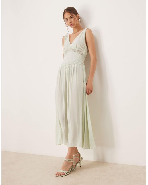 Robe mi-longue avec col v et détail en dentelle - pâle Mango en coloris Natural