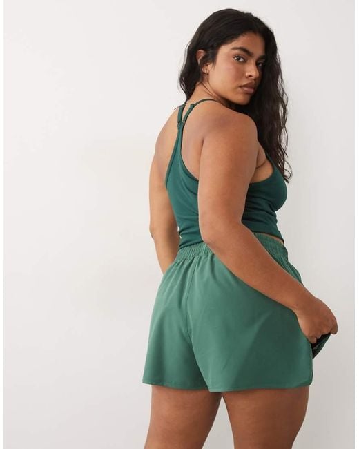 4505 Green Curve Icon Woven Running Shorts With Zip Pockets