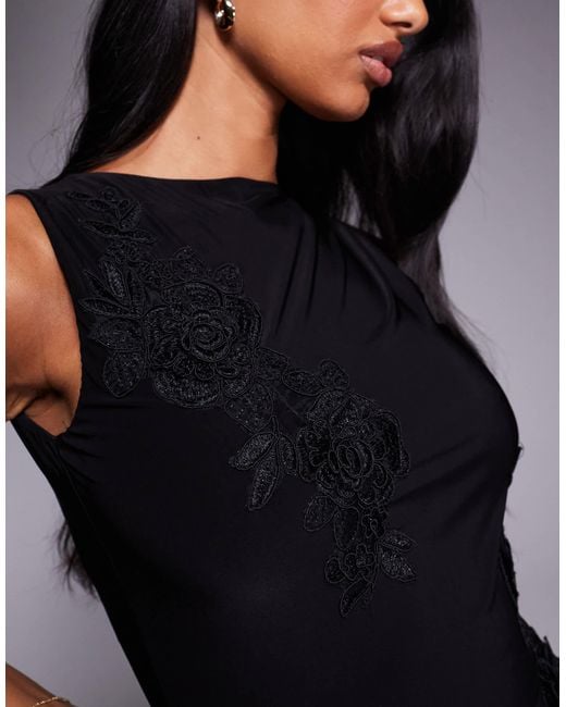 Fashionkilla Black Double-sculpted Slinky Slash Neck Low Back Ruffle Hem Flower Applique Mini Dress