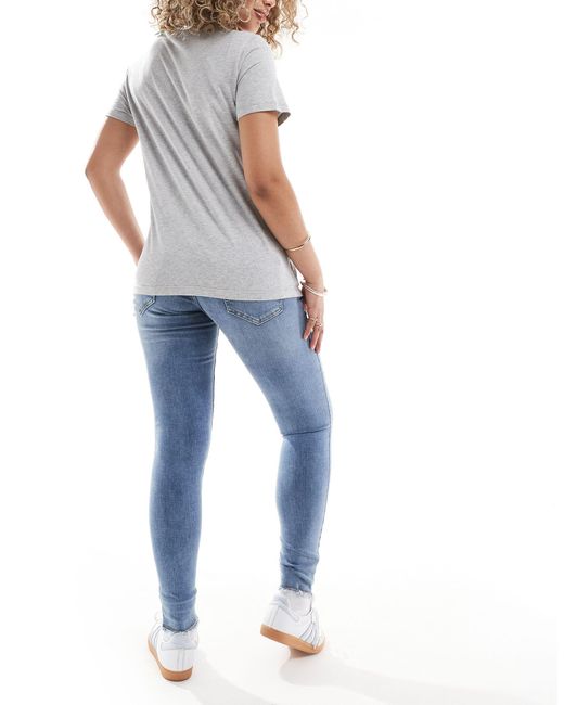 Sh - jeans skinny medio con fondo sfrangiato di ONLY in Blue
