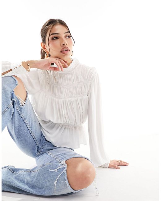 High neck clearance puff sleeve blouse