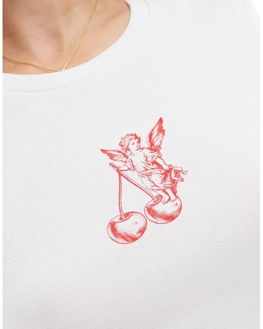 T-shirt effet rétréci à imprimé cupidon Stradivarius en coloris White