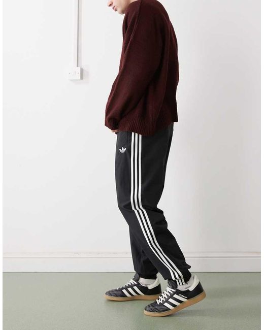 Adidas Originals Black Firebird Woven Track Pants for men