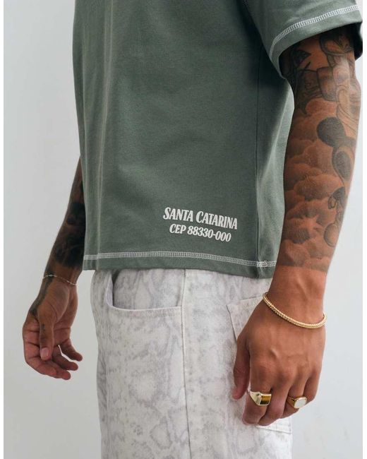 CERNUCCI Green Movie Theatre Back Graphic Boxy T-Shirt for men