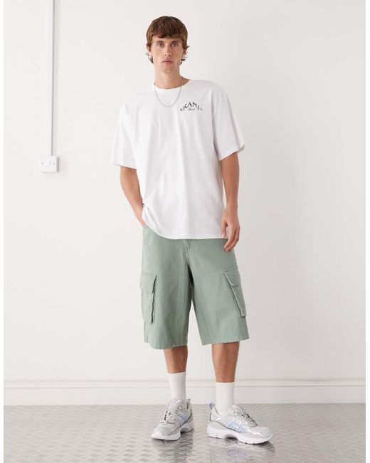 Camiseta Blanca Extragrande Con Estampado De Palmera En El Pecho Y La Espalda De Karlkani de hombre de color White