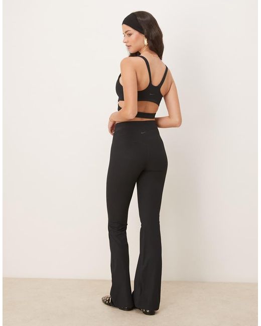 Pantalones De Campana Negros De Talle Alto Con Abertura De Canalé Dri-Fit Zenvy De Nike de color Blue