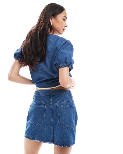 Mini-jupe en denim à ourlet à points ASOS en coloris Blue