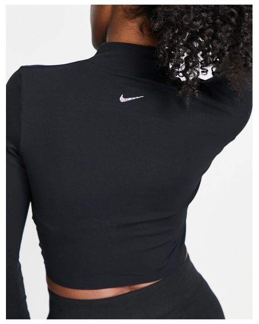 Nike yoga luxe - crop top à manches longues en tissu dri-fit Nike en coloris Black