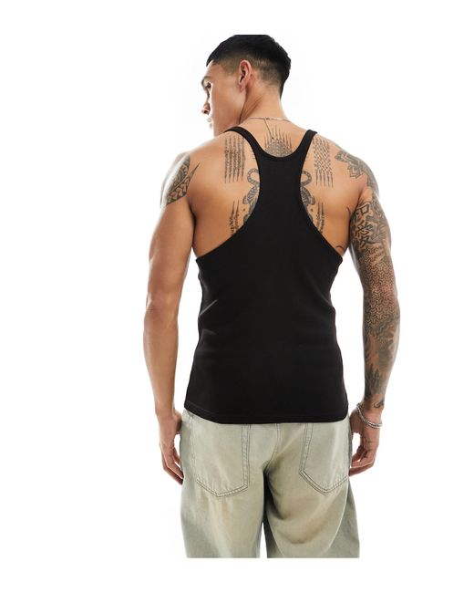 Camiseta negra sin mangas ajustada con espalda ASOS de hombre de color Black