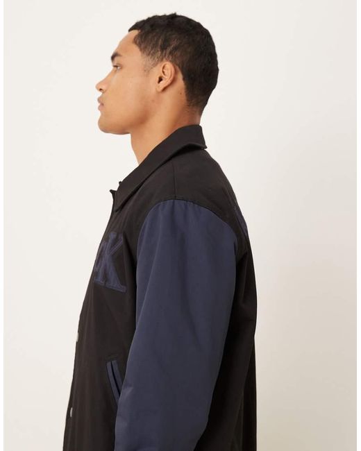 Chaqueta Bomber Negra Y Azul De Estilo Universitario De Algodón De Calvin Klein de hombre de color Black