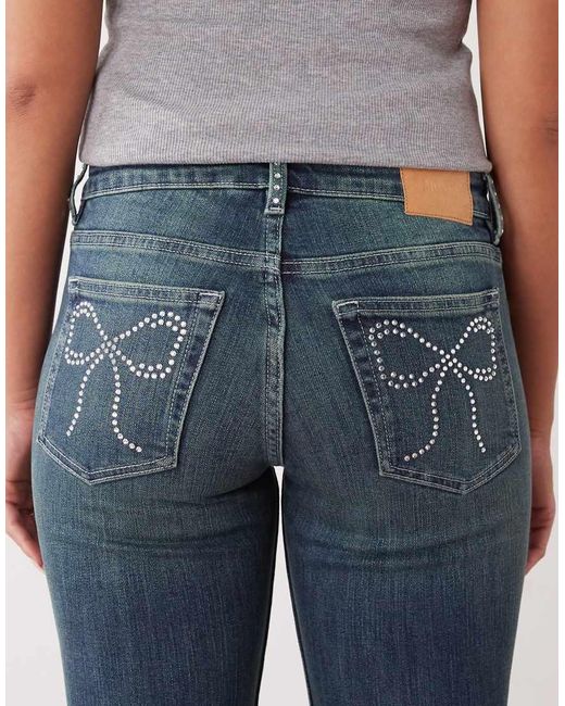 Monki Blue Katsumi Low Waist Flare Jeans With Bow Embellishment