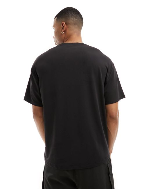 T-shirt da allenamento ampia di ASOS 4505 in Black da Uomo