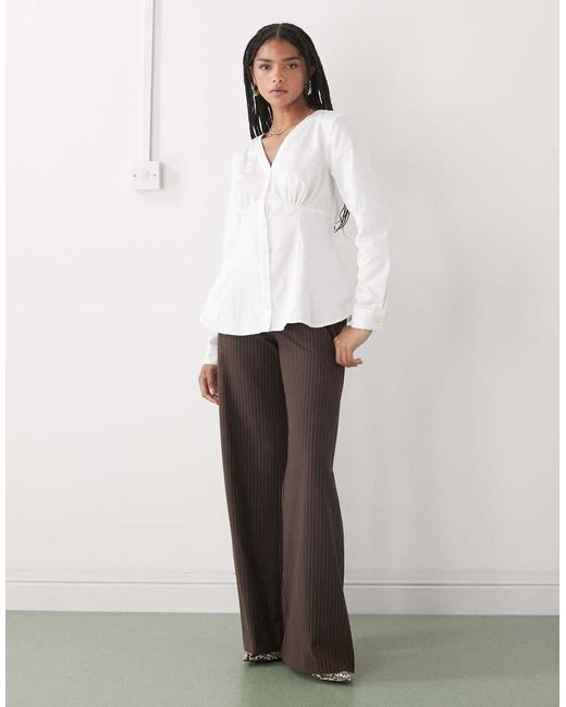 Reclaimed Vintage White Cinched -n Shirt With Seam Details And Peplum Hem