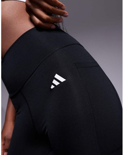 Adidas Originals Blue Adidas Training Essentials leggings With Phone Pocket