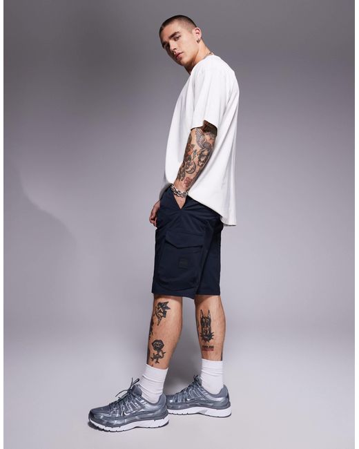 Urbanex - short cargo technique Boss pour homme en coloris Blue