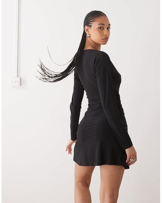 Reclaimed Vintage Slouchy Off Shoulder Long Sleeve Skort Mini Dress in Black  | Lyst Canada