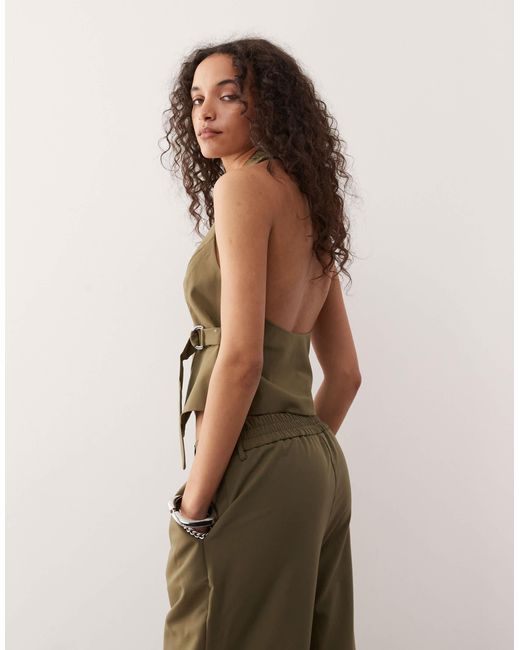 Collusion Green – elegante, figurbetonte weste