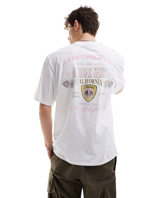 T-shirt unisexe style universitaire avec imprimé sur la poitrine et au dos Guess en coloris White