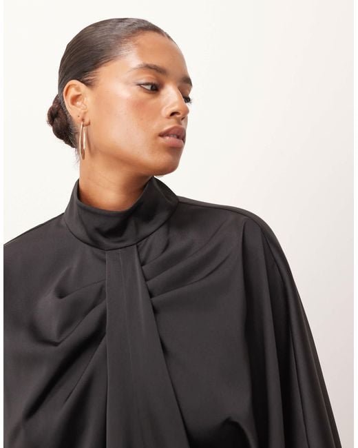 ARRANGE Black Curve High Neck Drape Cape Top