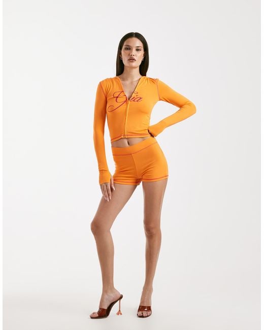 I.AM.GIA Orange Blare Logo Back Print Contrast Stitch Shorts