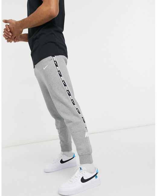 Nike Repeat Pack Taping Cuffed joggers in Grey (Grey) for Men | Lyst UK