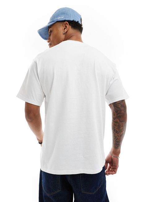 T-shirt bianca con logo batwing al centro di Levi's in White da Uomo