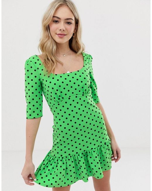 green polka dot mini dress