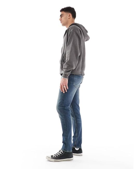 Vaqueros Ajustados En De ASOS de hombre de color Blue