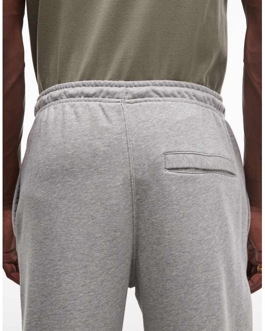Nike White Club French Terry Cuffed Joggers for men