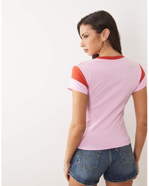 ASOS Pink Patchwork Sleeve Baby Tee With Varsity Tokyo Graphic