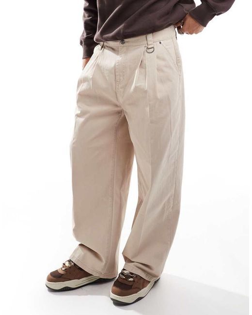 The Ragged Priest Natural Wide Fit Twill Pleat Chinos for men