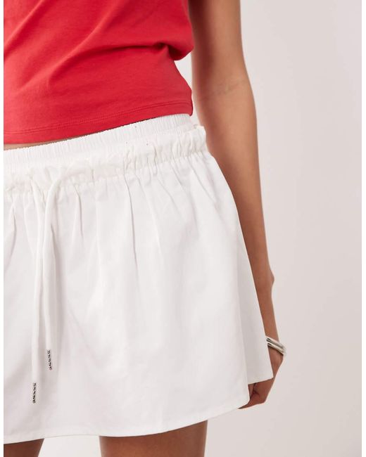 The Frolic Red Exclusive Ruffle Waist Poplin Micro Skort