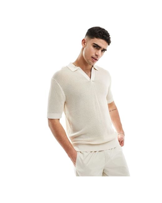 Lifestyle - polo en maille ajourée - beige Calvin Klein pour homme en coloris White