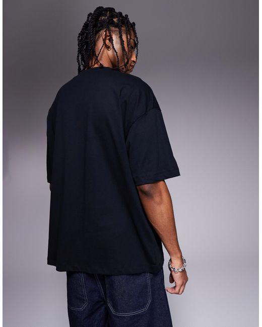 T-shirt oversize à imprimé fleurs sur la poitrine ASOS pour homme en coloris Blue