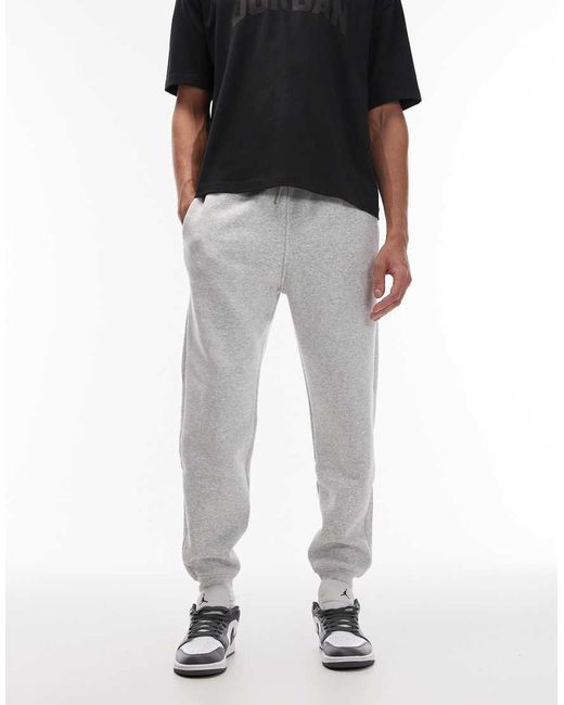 Joggers Grises Con Bajos Ajustados De Felpa De Nike de hombre de color Black