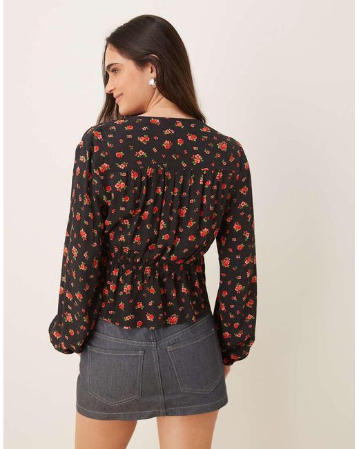 Blusa Negra Con Estampado De Rosas Y Lazada Delantera De Mango de color Brown