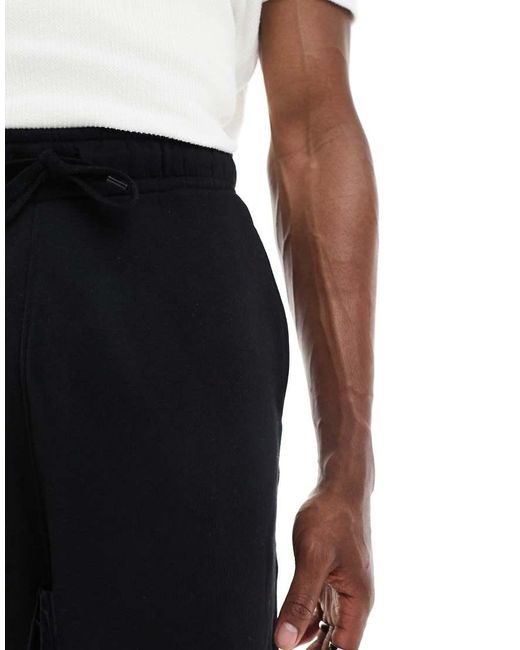 Pantalones Cortos Negros Básicos Extragrandes De Largo Medio De ASOS de hombre de color Black