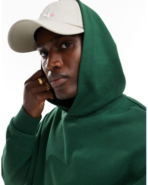Sudadera extragrande con capucha y estampado ASOS de hombre de color Green
