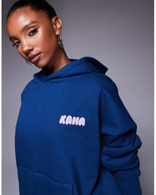 Sweat à capuche d'ensemble en coton majoritaire avec logo au dos Kaiia en coloris Blue