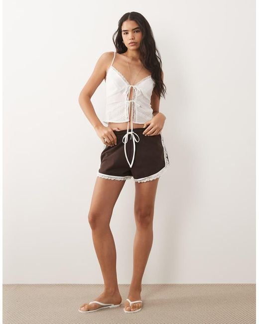 The Frolic White Exclusive Dobby Cotton Lace Trim Tie Front Cami Top