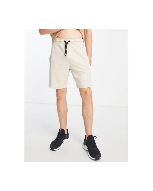 Pantalones cortos color pálido deportivo extragrandes Threadbare de hombre de color Natural