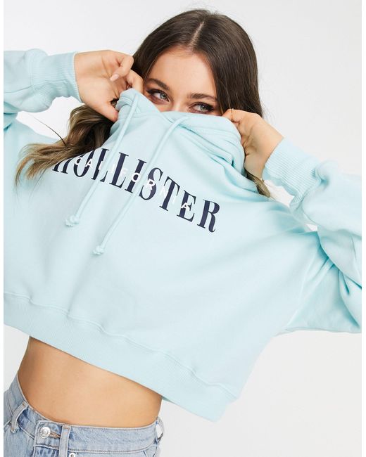Sudadera corta azul con capucha y logo Hollister de color Azul | Lyst