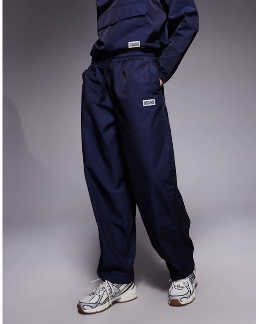 ASOS Blue Weekend Collective Barrel Leg Nylon Trackies