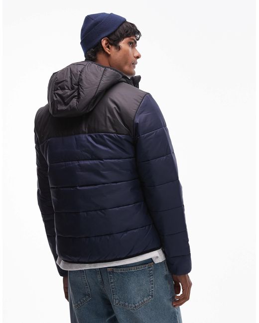 Lacoste – essentials – gesteppte puffer-jacke mit em blockfarben-design in Blue für Herren