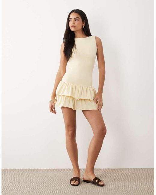 Fashionkilla Natural Exclusive Cotton Rich Sleeveless Drop Waist Ruffle Hem Mini Dress
