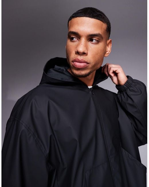 ASOS – gummierte, kastige oversize-regenjacke in Blue für Herren