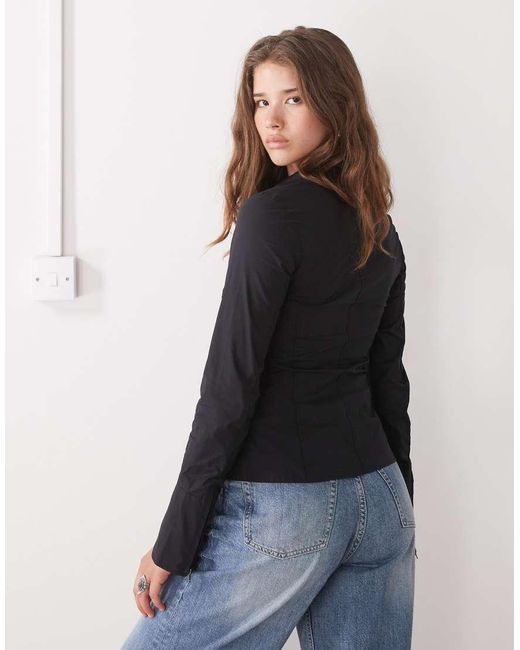 Camisa Negra Con Mangas Acampanadas Y Cremallera De Weekday de color Blue